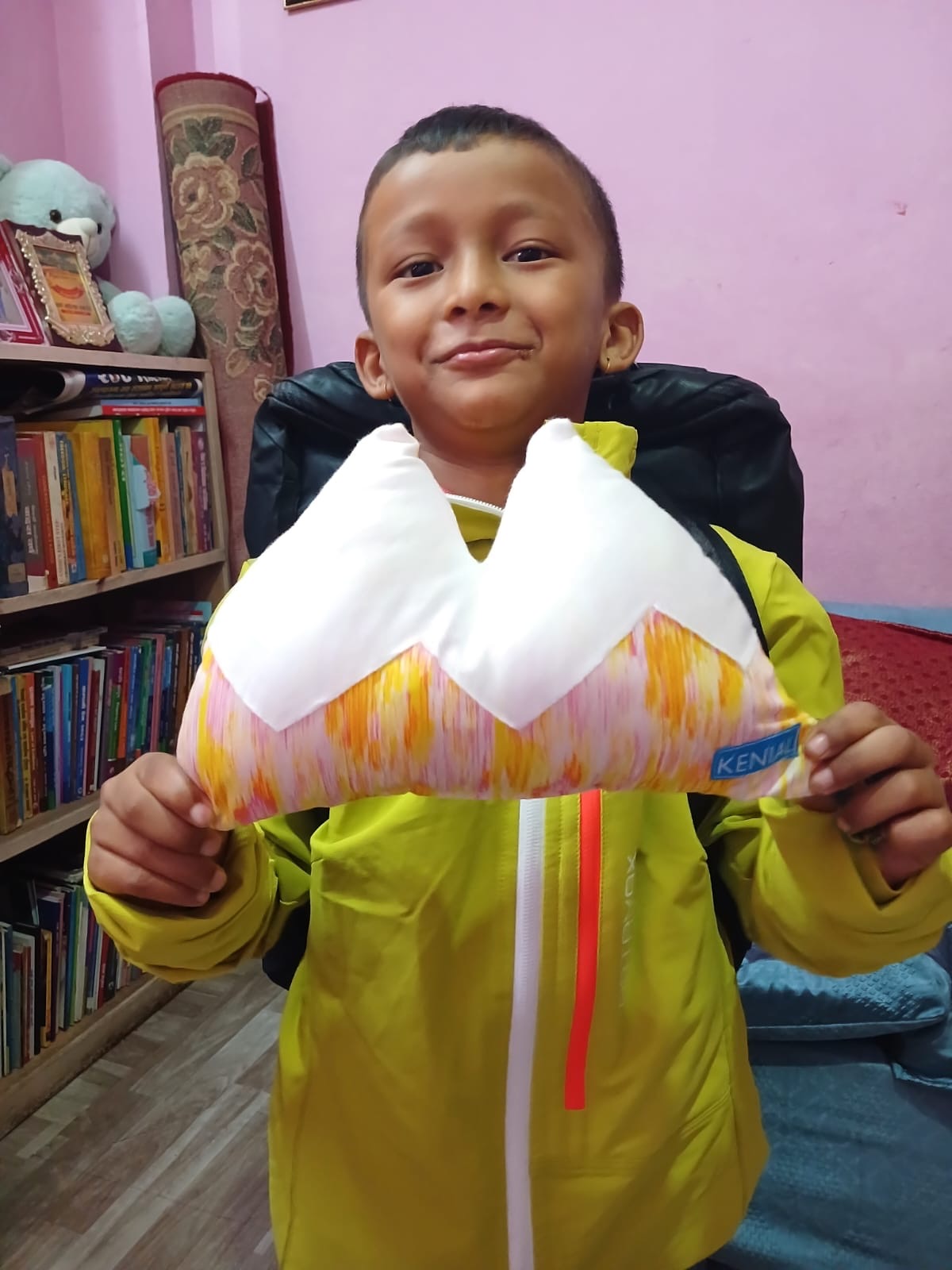 child with pillow and new jacket