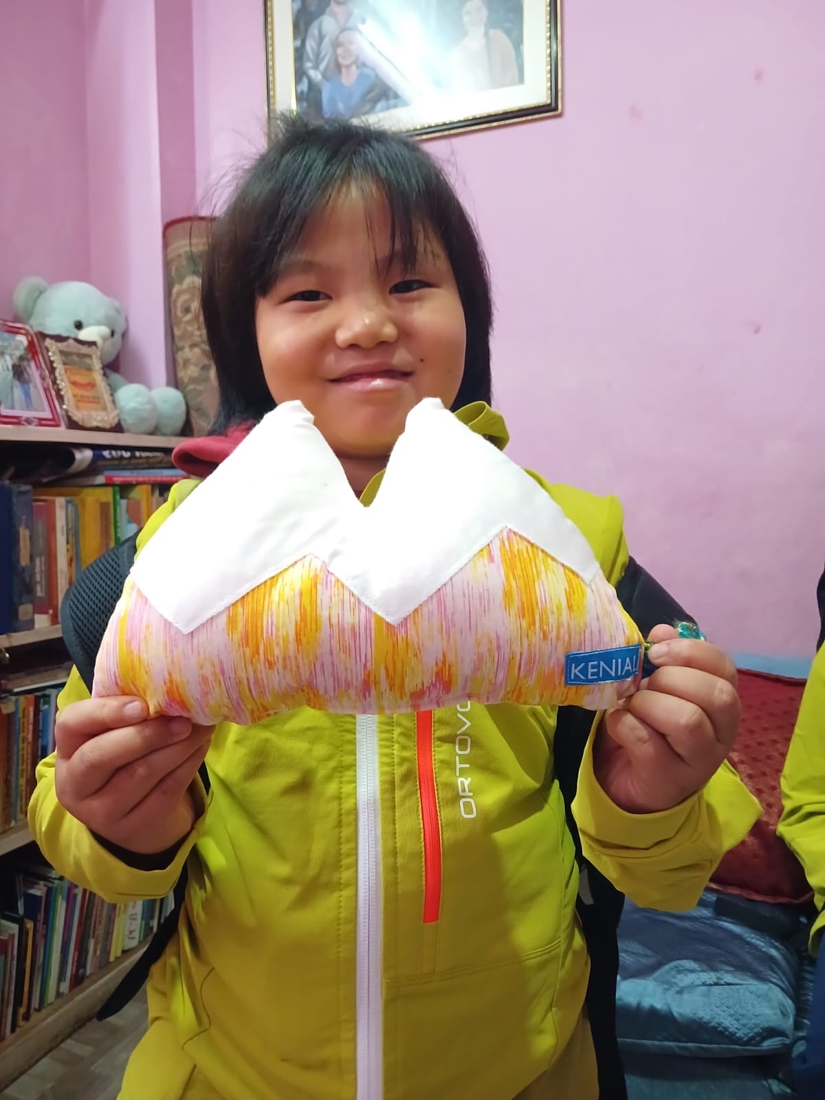 child with pillow and new jacket